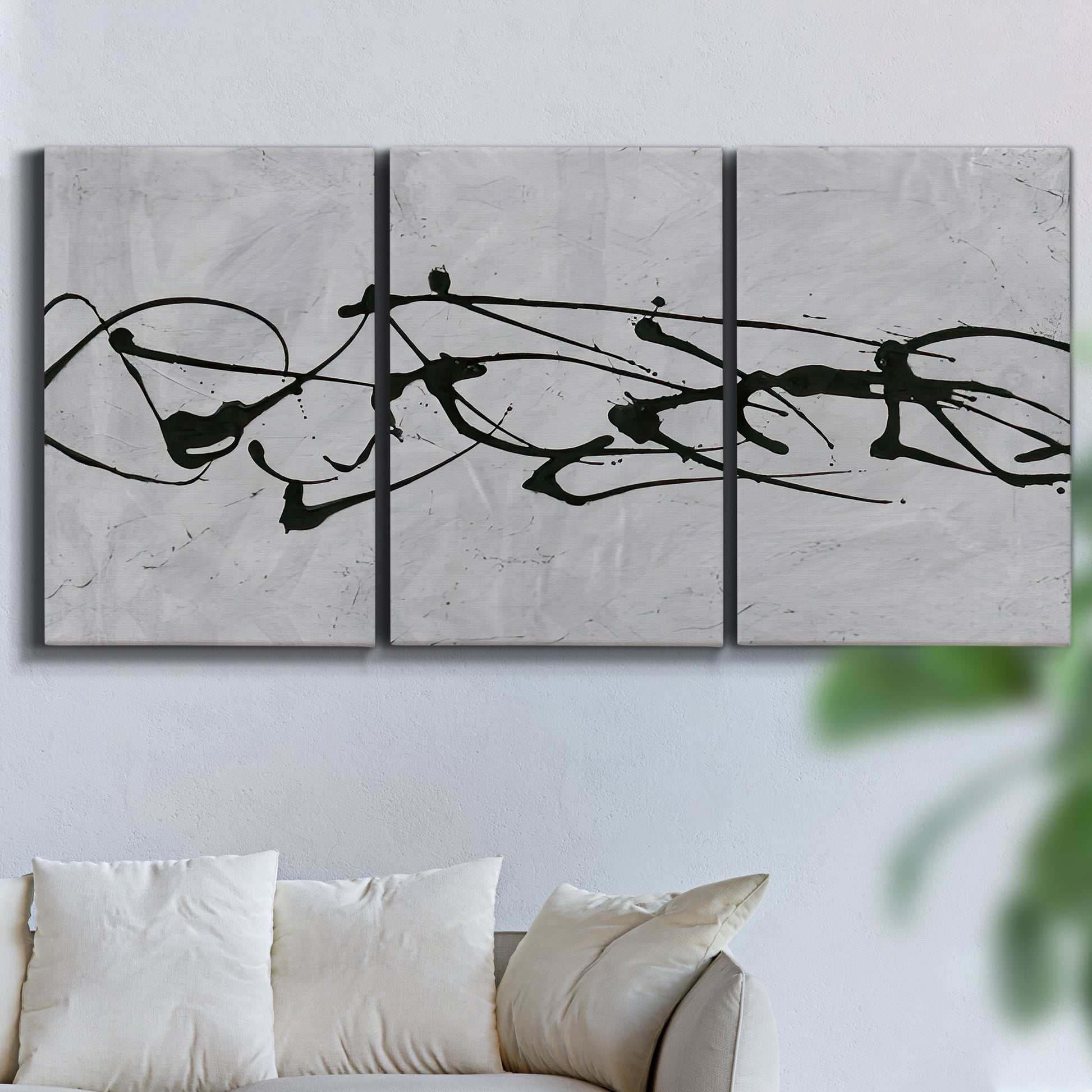 Three-panel canvas wall art featuring minimal abstract frequency lines, displayed in a living room above a sofa.
