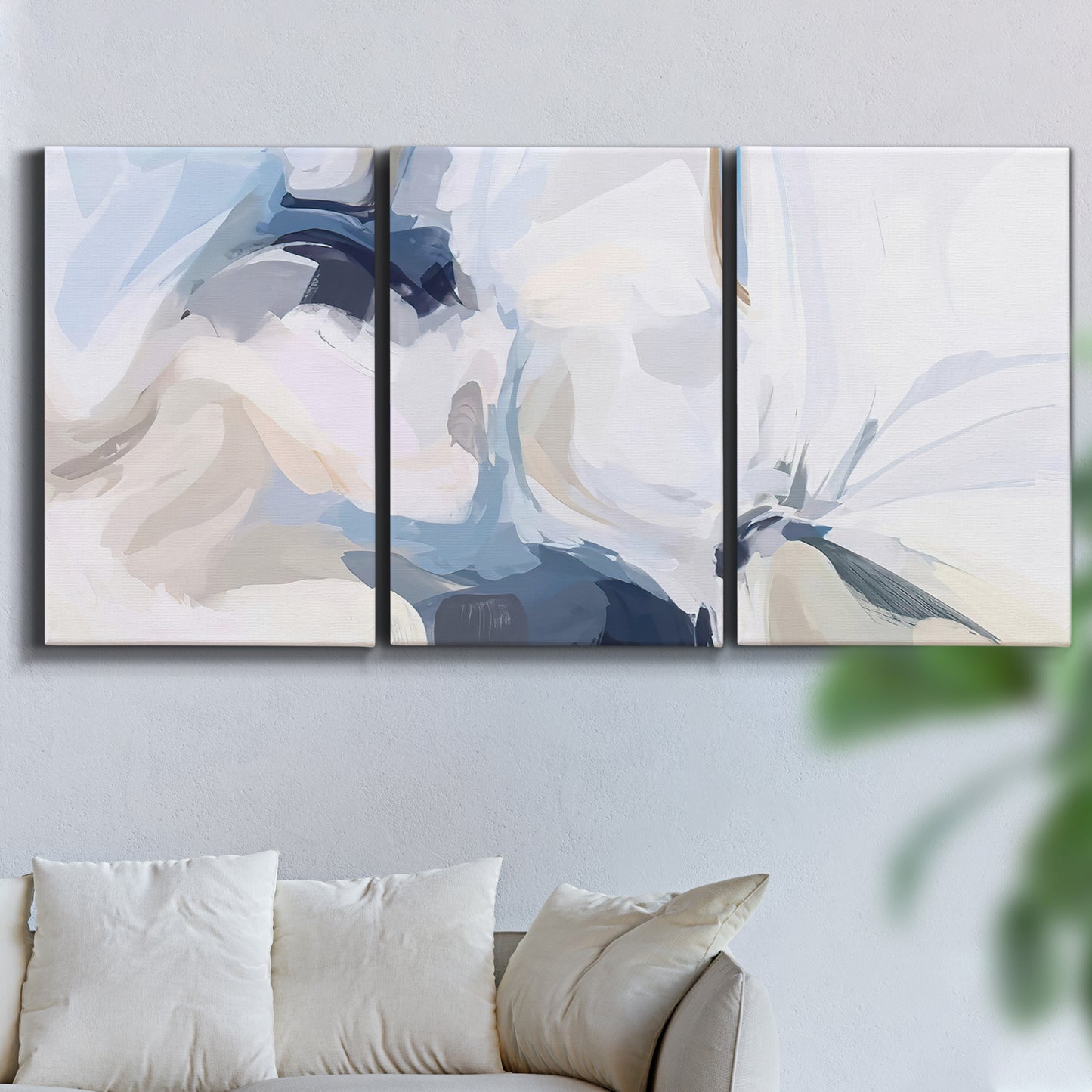 Three-panel canvas wall art featuring airy abstract movement composition, displayed in a living room above a sofa.
