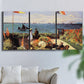 Three-panel canvas wall art featuring coastal garden overlooking sea, displayed in a living room above a sofa.