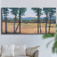 Three-panel canvas wall art featuring quiet morning landscape with trees, displayed in a living room above a sofa.