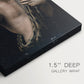 Close-up of a gallery-wrapped canvas corner showing a calm portrait with strong contrast and depth, highlighting texture and print detail.