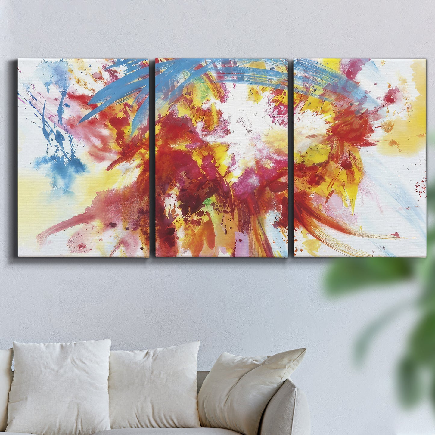 Three-panel canvas wall art featuring bright abstract summer palette, displayed in a living room above a sofa.