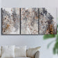 Three-panel canvas wall art featuring wooded trail through forest, displayed in a living room above a sofa.