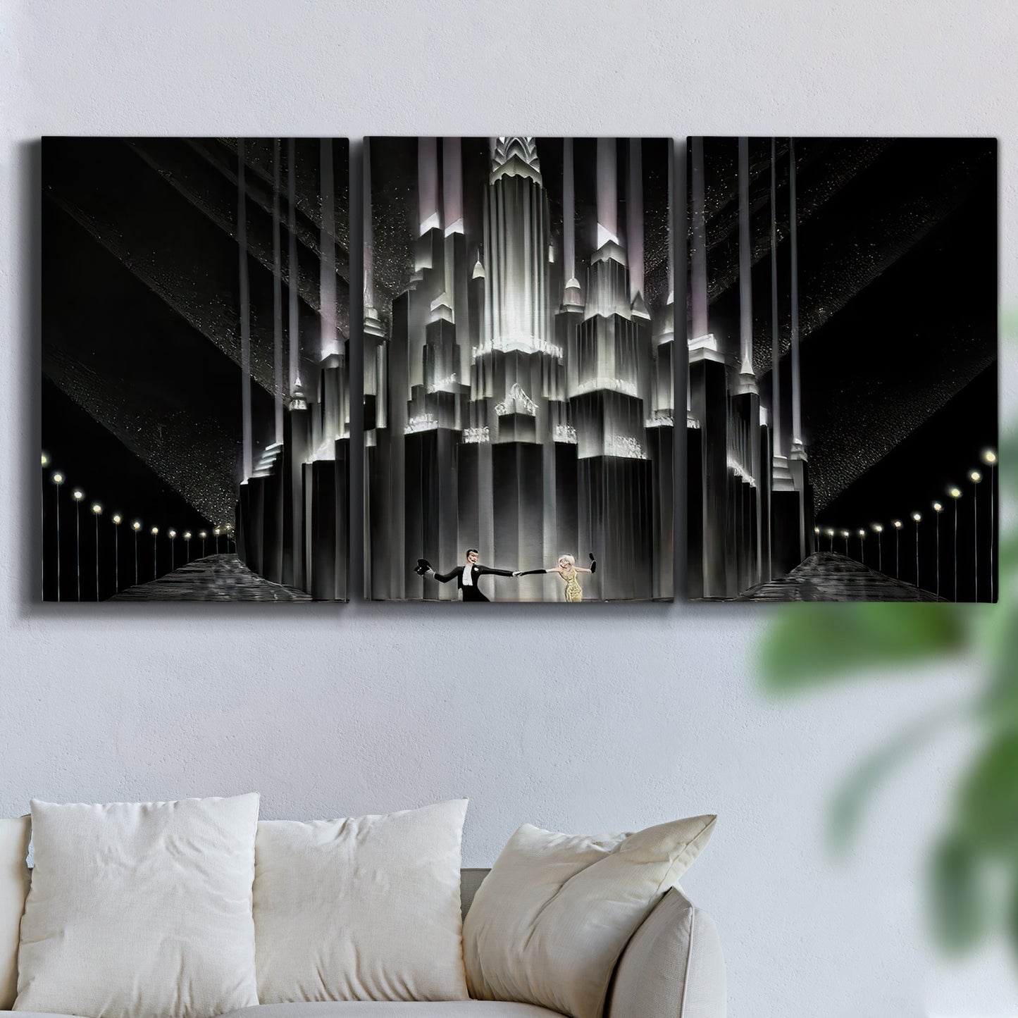 Three-panel canvas wall art featuring vintage city scene with figures, displayed in a living room above a sofa.