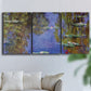 Three-panel canvas wall art featuring blue and purple water lily pond, displayed in a living room above a sofa.