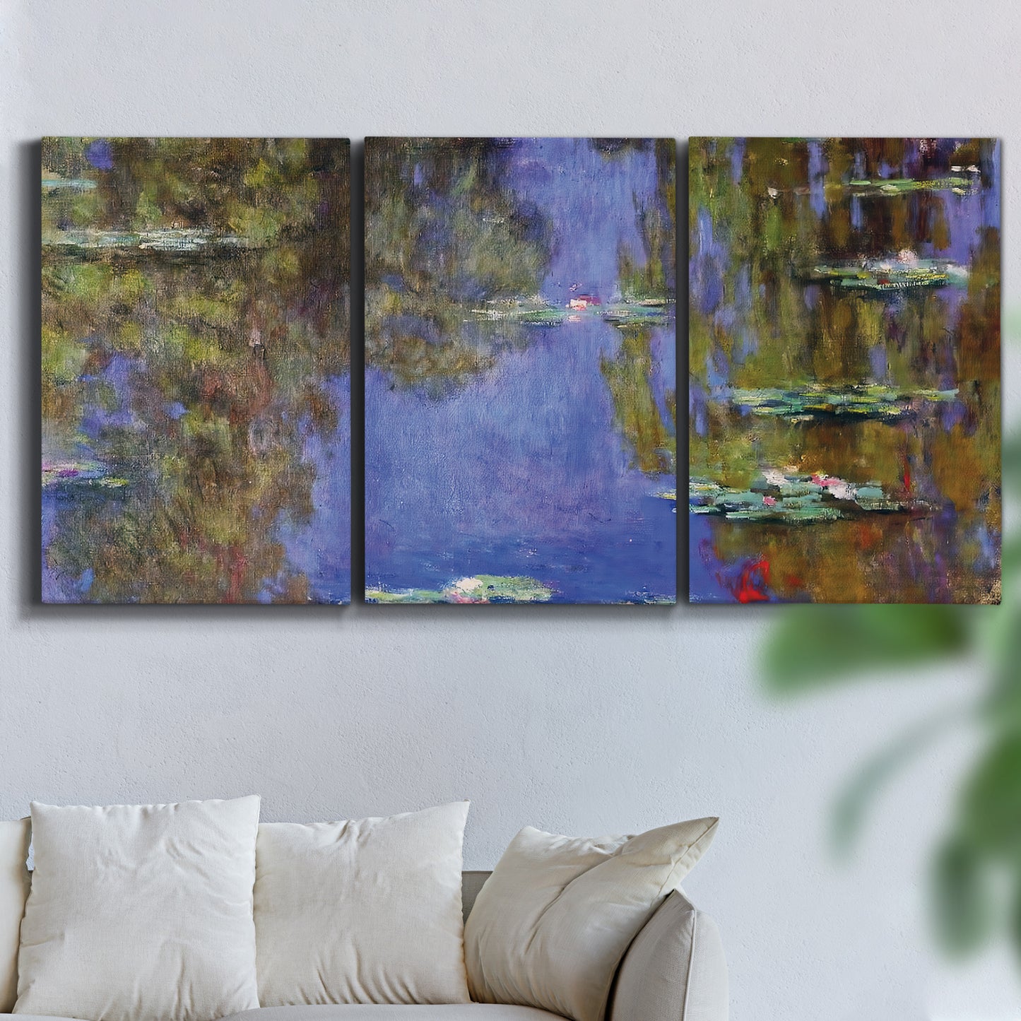 Three-panel canvas wall art featuring blue and purple water lily pond, displayed in a living room above a sofa.