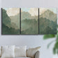 Three-panel canvas wall art featuring autumn storm over rolling landscape, displayed in a living room above a sofa.