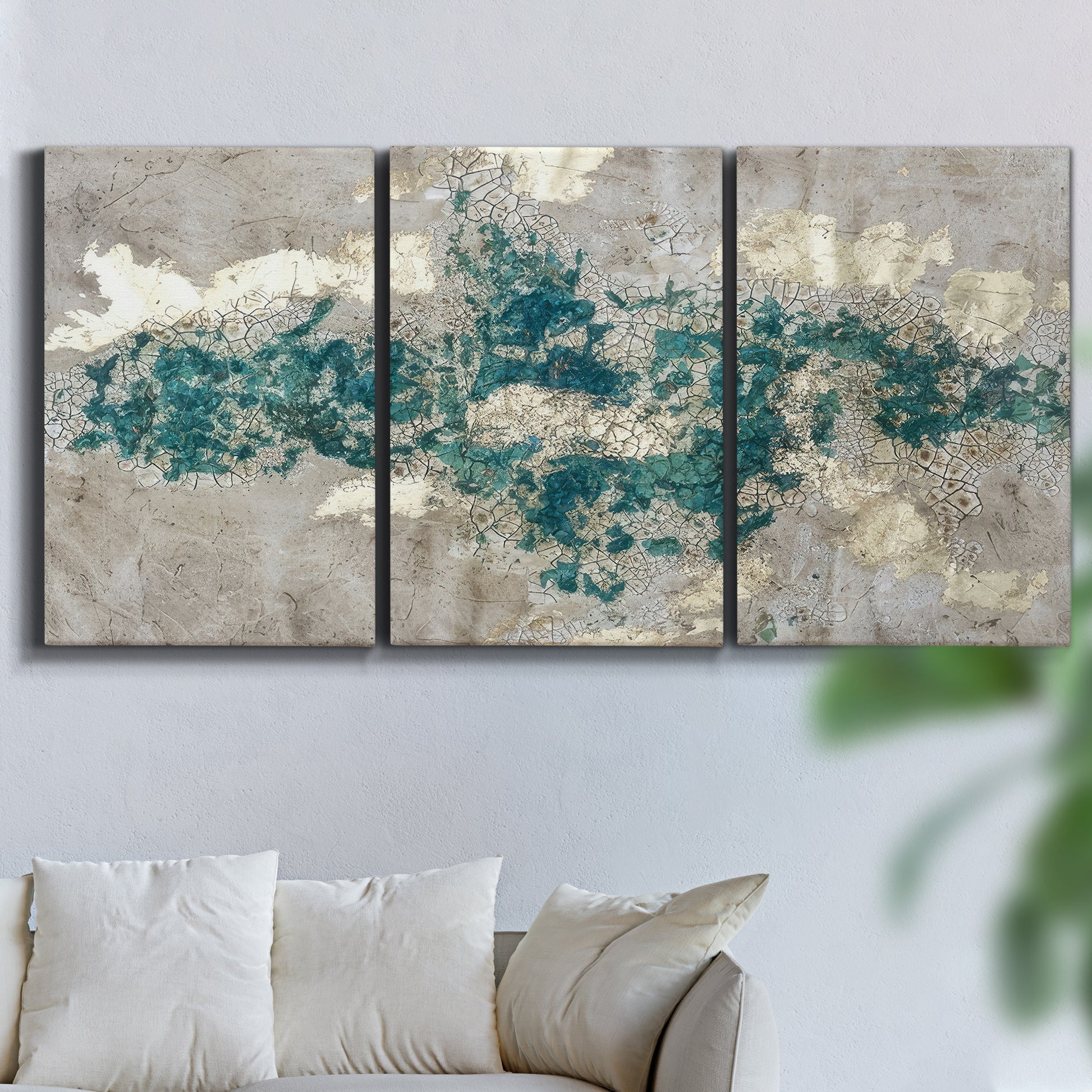 Three-panel canvas wall art featuring layered mineral abstract textures, displayed in a living room above a sofa.