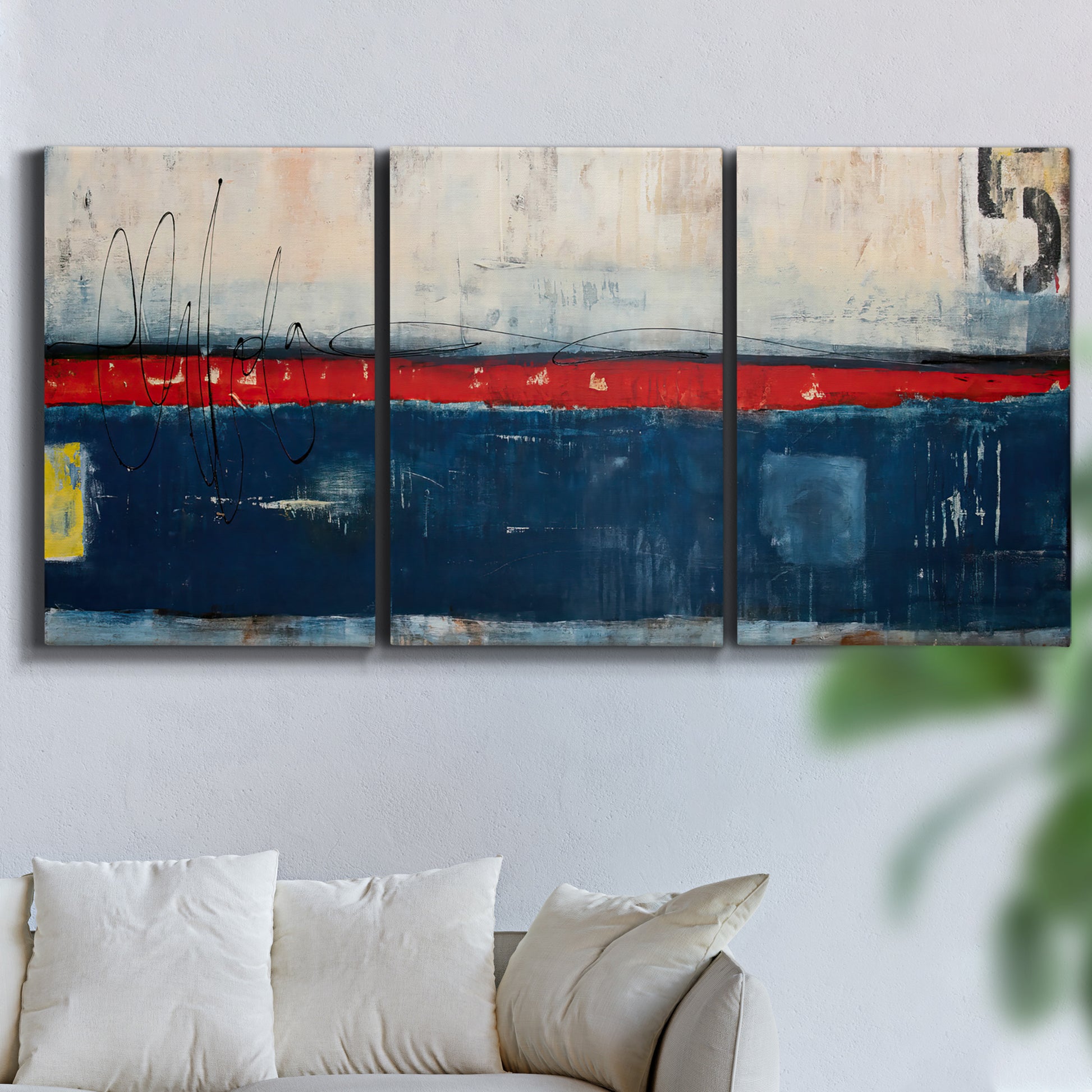 Three-panel canvas wall art featuring weathered coastal dock scene, displayed in a living room above a sofa.