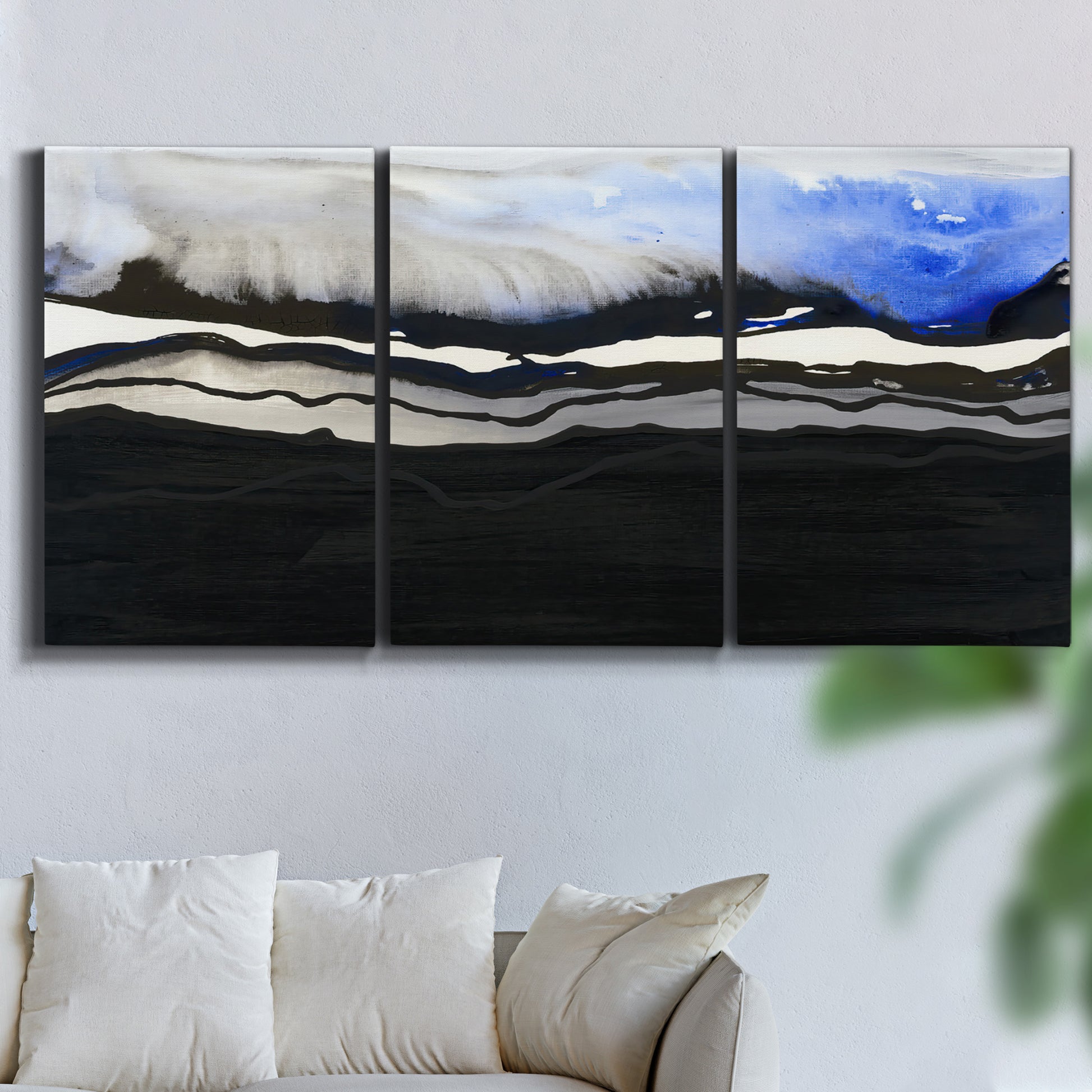 Three-panel canvas wall art featuring abstract passage of time composition, displayed in a living room above a sofa.