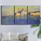 Three-panel canvas wall art featuring layered modern abstract color ribbons, displayed in a living room above a sofa.