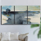 Three-panel canvas wall art featuring abstract watercolor with upward motion, displayed in a living room above a sofa.