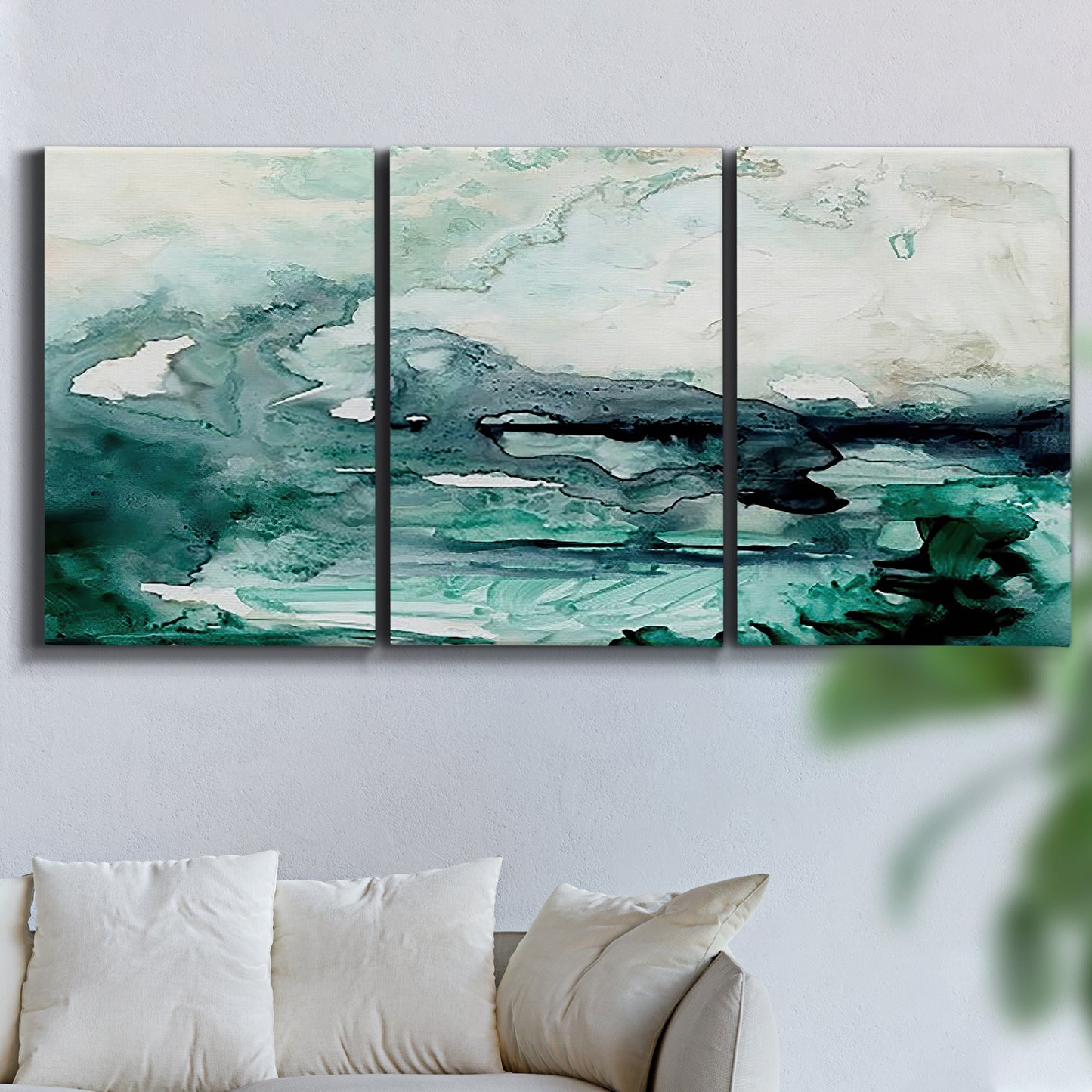 Three-panel canvas wall art featuring coastal abstract sea foam movement, displayed in a living room above a sofa.