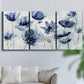 Three-panel canvas wall art featuring indigo floral blossoms awakening, displayed in a living room above a sofa.