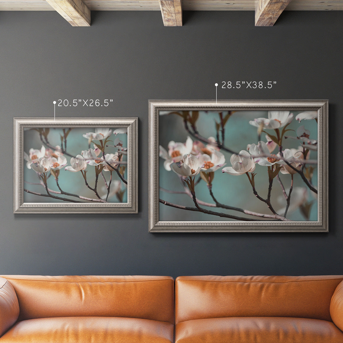 Close-up dogwood blossom photography in an ornate vintage silver frame displayed in a dark-toned interior setting.