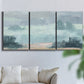 Three-panel canvas wall art featuring soft pastel valley landscape, displayed in a living room above a sofa.