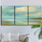 Three-panel canvas wall art featuring calm coastal drift patterns, displayed in a living room above a sofa.