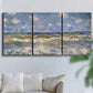Three-panel canvas wall art featuring rough sea with crashing waves, displayed in a living room above a sofa.