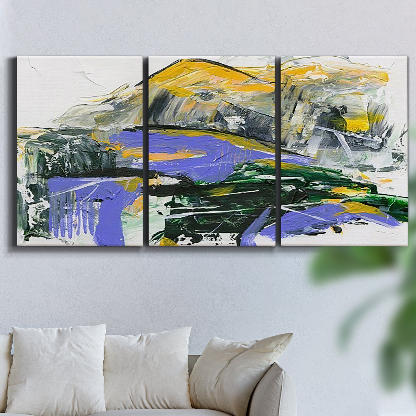 Three-panel canvas wall art featuring quiet abstract mountain silhouette, displayed in a living room above a sofa.