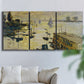 Three-panel canvas wall art featuring working harbor with boats, displayed in a living room above a sofa.