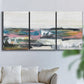 Three-panel canvas wall art featuring cheerful abstract coastal seascape, displayed in a living room above a sofa.
