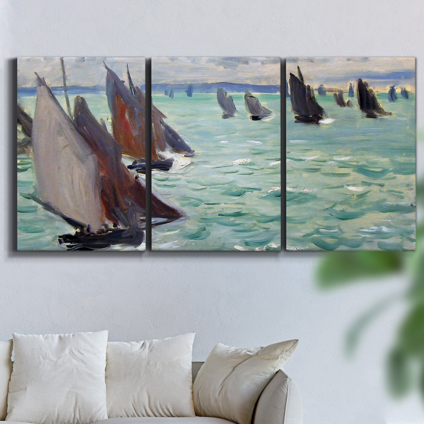 Three-panel canvas wall art featuring sailboat regatta near coastal village, displayed in a living room above a sofa.