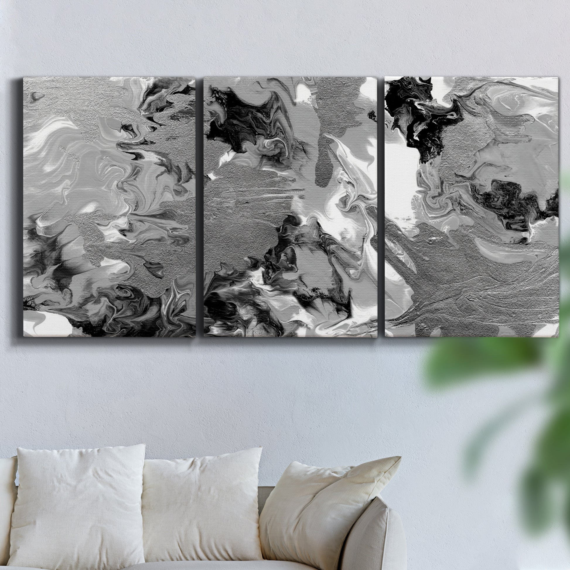 Three-panel canvas wall art featuring abstract marble texture composition, displayed in a living room above a sofa.