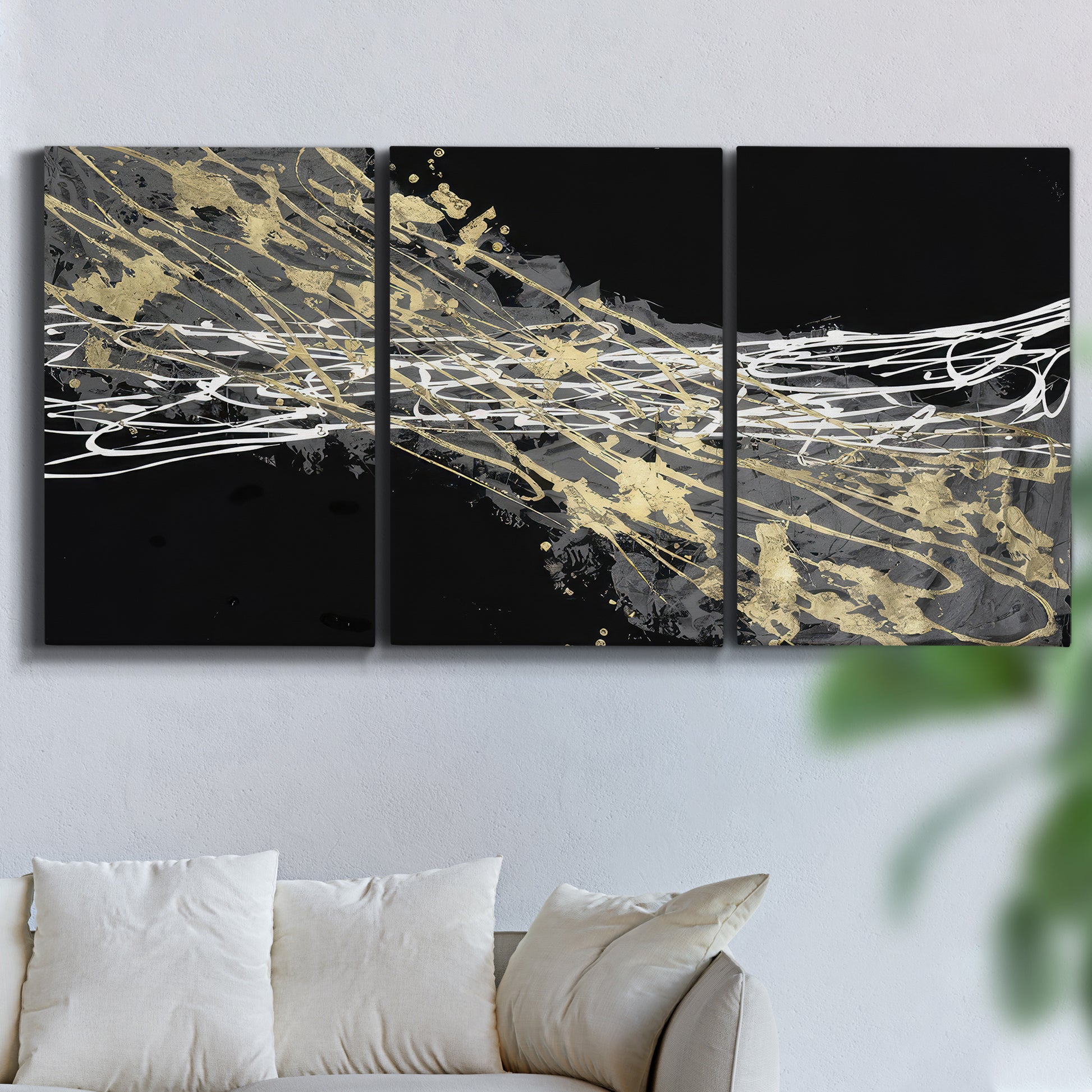 Three-panel canvas wall art featuring dark modern abstract wind patterns, displayed in a living room above a sofa.