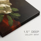 Canvas art print of a white magnolia bloom resting on red velvet surface, highlighting texture and gallery-wrapped edges