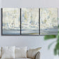 Three-panel canvas wall art featuring impressionist regatta scene with sailboats, displayed in a living room above a sofa.
