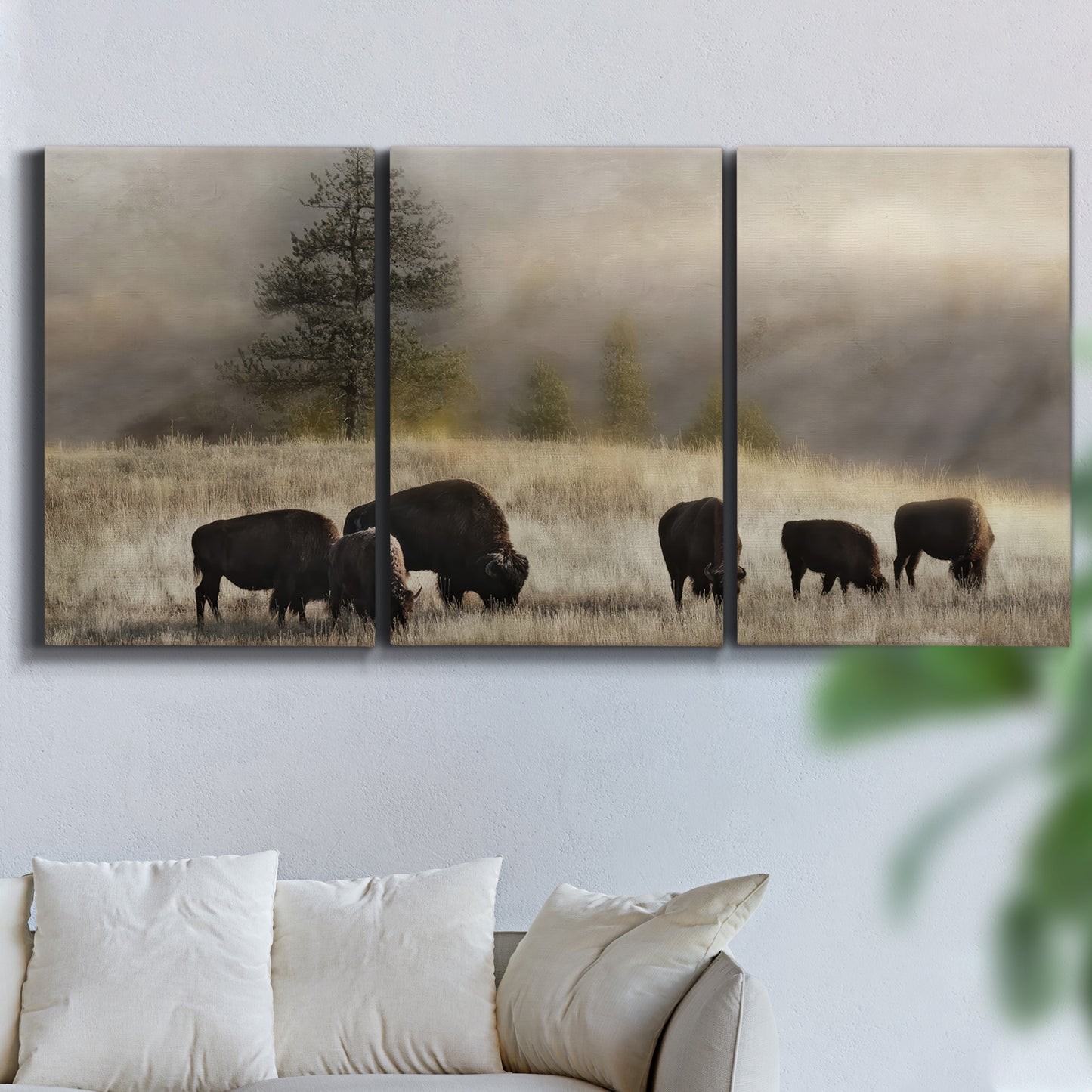 Three-panel canvas wall art featuring cattle grazing along ridge line, displayed in a living room above a sofa.