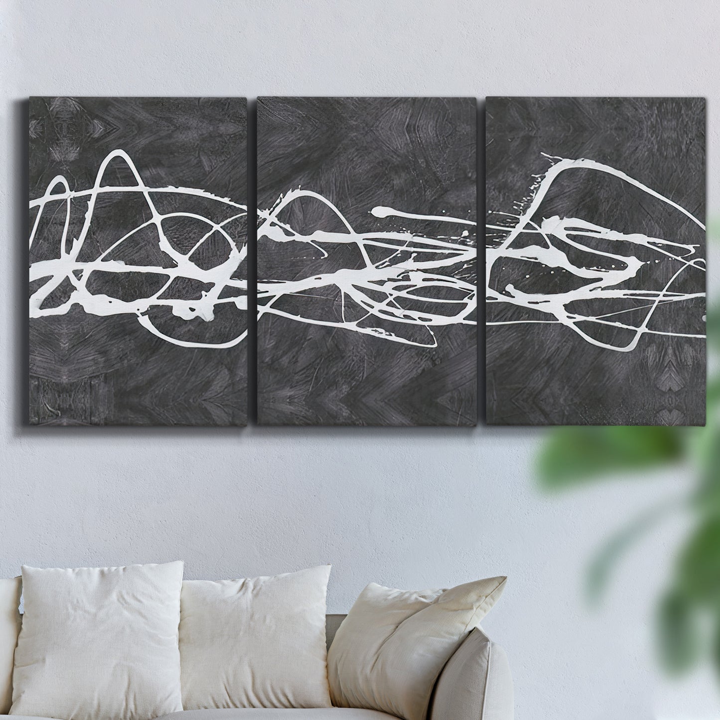 Three-panel canvas wall art featuring minimal abstract frequency lines, displayed in a living room above a sofa.