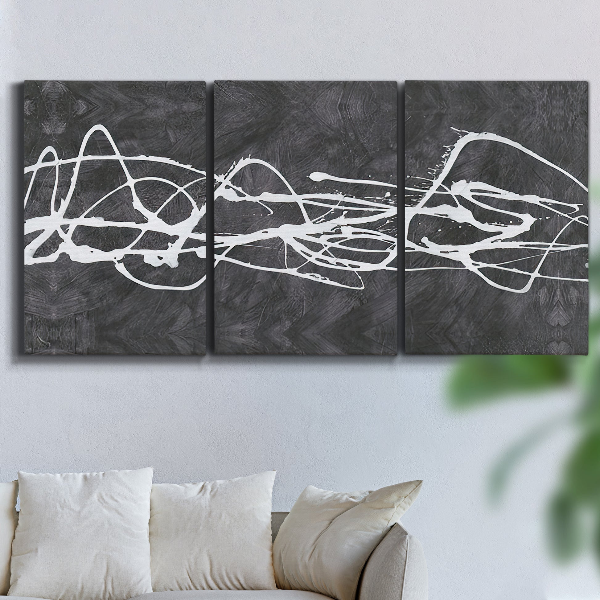 Three-panel canvas wall art featuring minimal abstract frequency lines, displayed in a living room above a sofa.
