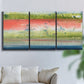 Three-panel canvas wall art featuring layered abstract color banding, displayed in a living room above a sofa.