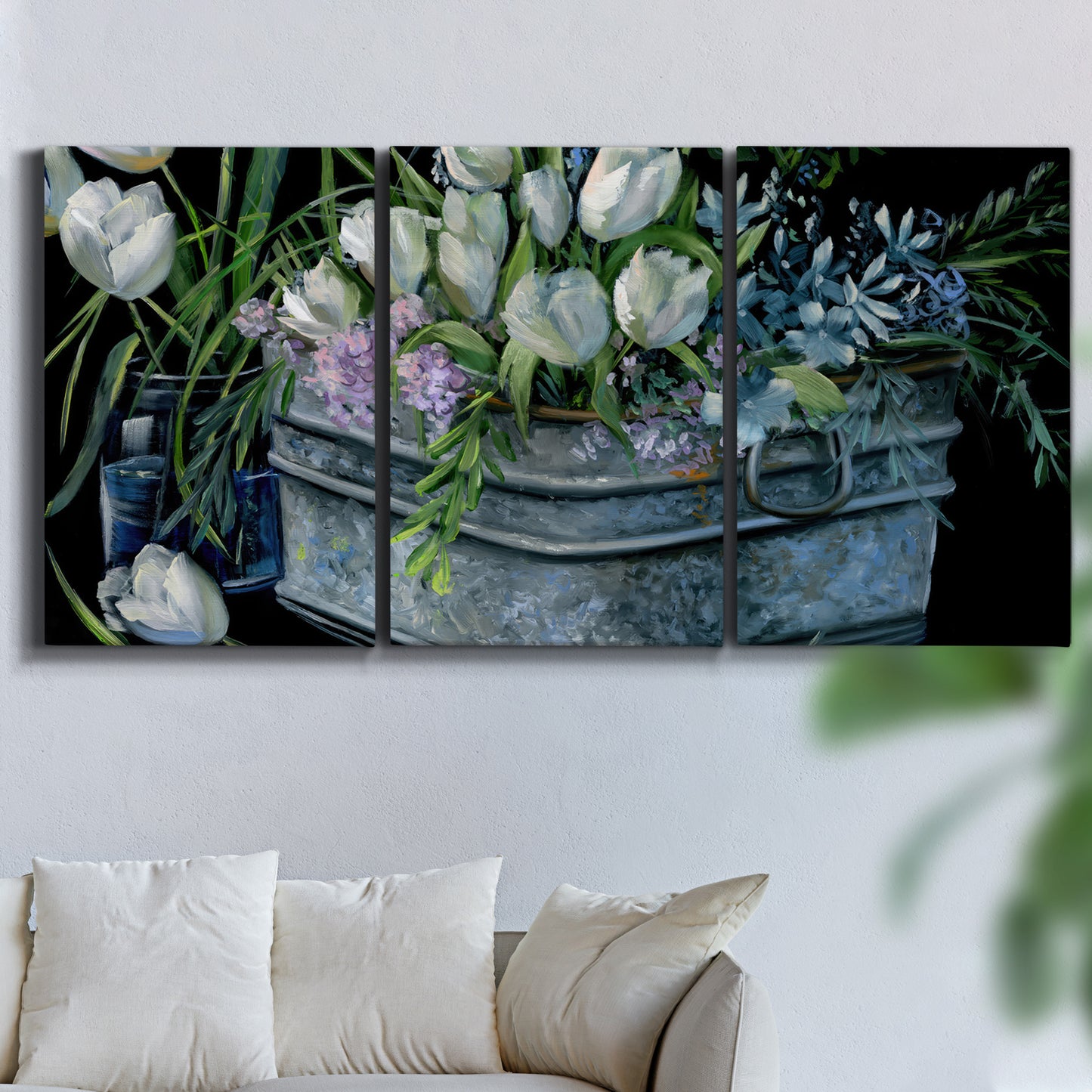 Three-panel canvas wall art featuring colorful wild tulips in bloom, displayed in a living room above a sofa.