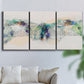Three-panel canvas wall art featuring abstract mountain range watercolor, displayed in a living room above a sofa.