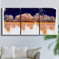 Three-panel canvas wall art featuring panoramic treeline landscape photograph, displayed in a living room above a sofa.