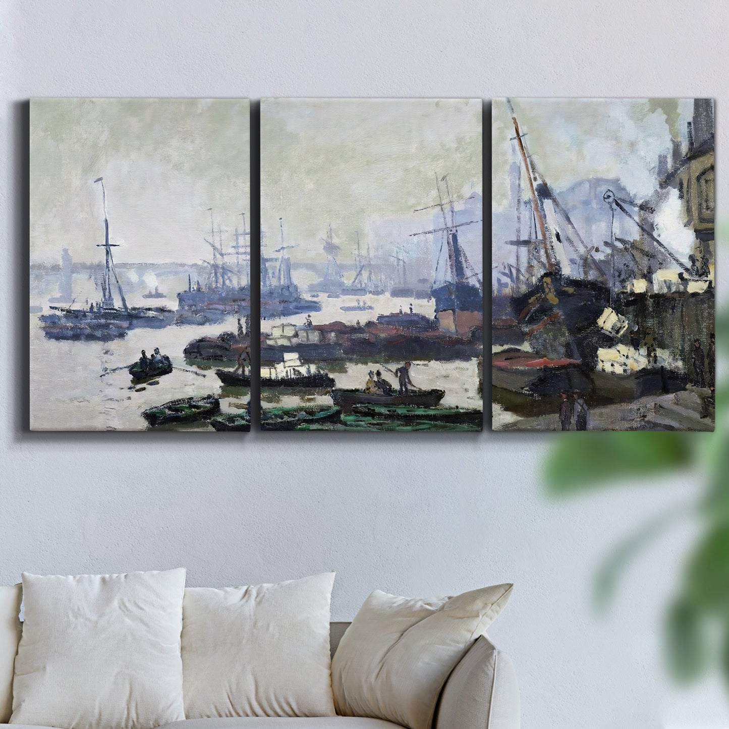 Three-panel canvas wall art featuring working harbor with docked boats, displayed in a living room above a sofa.