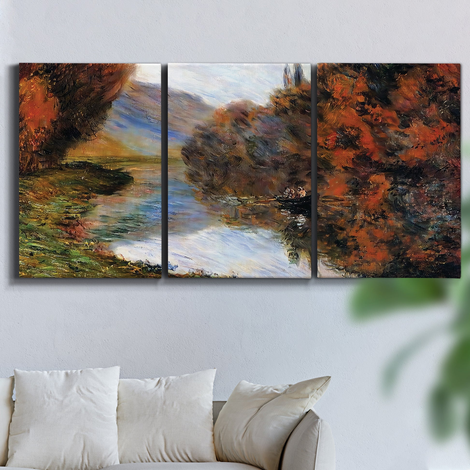 Three-panel canvas wall art featuring rowboat on quiet river bend, displayed in a living room above a sofa.