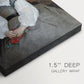 Close-up of a gallery-wrapped canvas corner showing a delicate portrait with light tones and simple composition, highlighting texture and print detail.