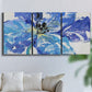 Three-panel canvas wall art featuring blue floral botanical close up, displayed in a living room above a sofa.