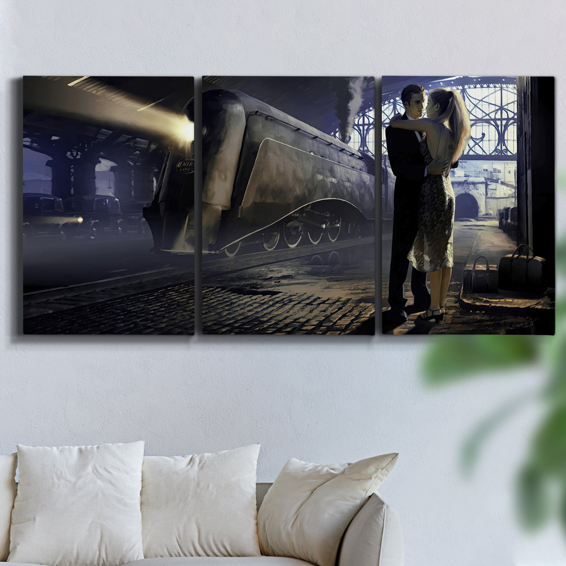 Three-panel canvas wall art featuring couple kissing at train station, displayed in a living room above a sofa.