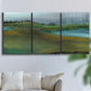 Three-panel canvas wall art featuring quiet contemplative landscape scene, displayed in a living room above a sofa.