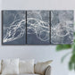 Three-panel canvas wall art featuring coastal shoreline at golden hour, displayed in a living room above a sofa.