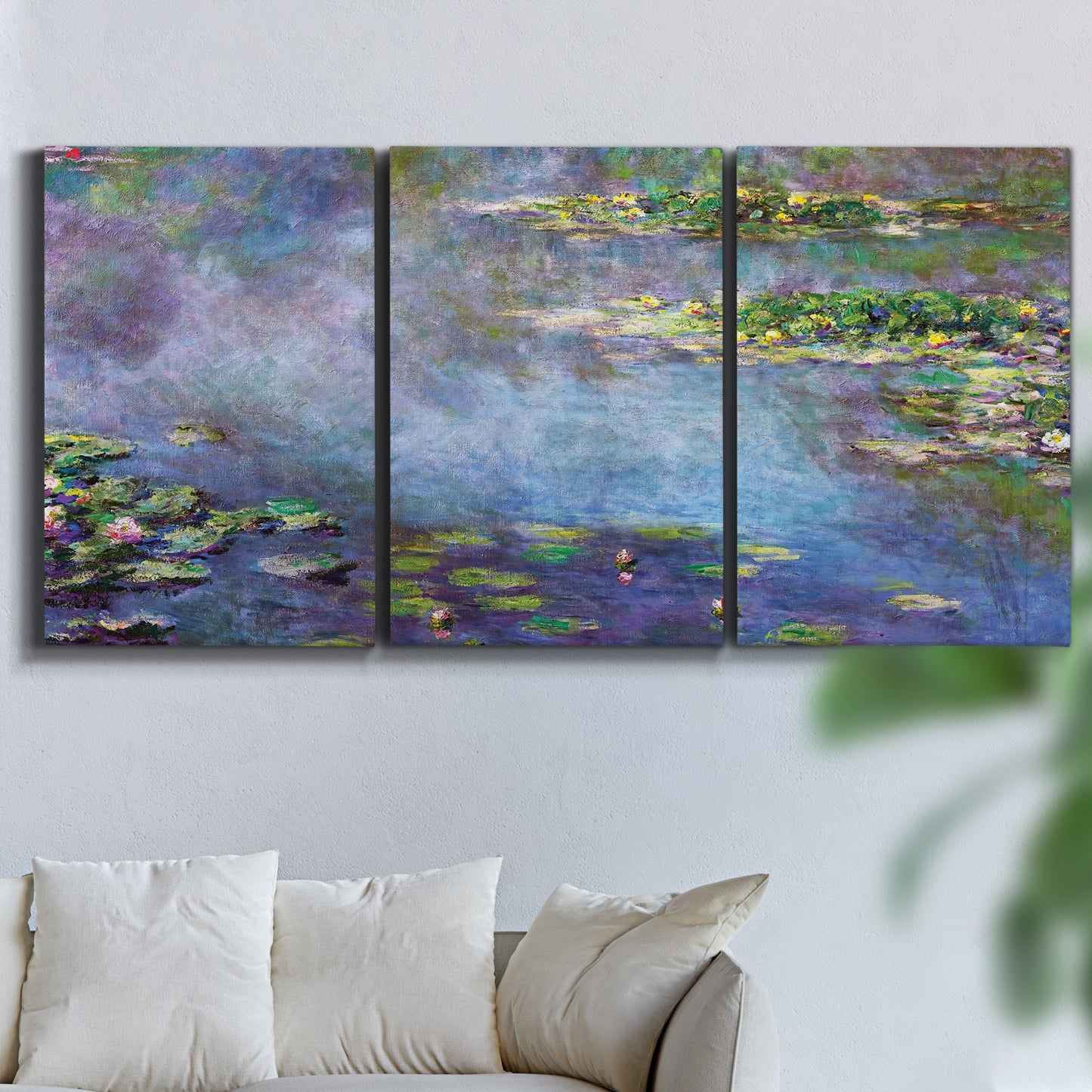 Three-panel canvas wall art featuring water lilies emerging through mist, displayed in a living room above a sofa.
