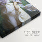 Close-up of a gallery-wrapped canvas corner showing a luminous figure in a seasonal setting, highlighting texture and print detail.