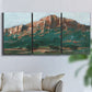 Three-panel canvas wall art featuring western landscape stretching into distance, displayed in a living room above a sofa.