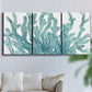 Three-panel canvas wall art featuring blue coral inspired watercolor, displayed in a living room above a sofa.