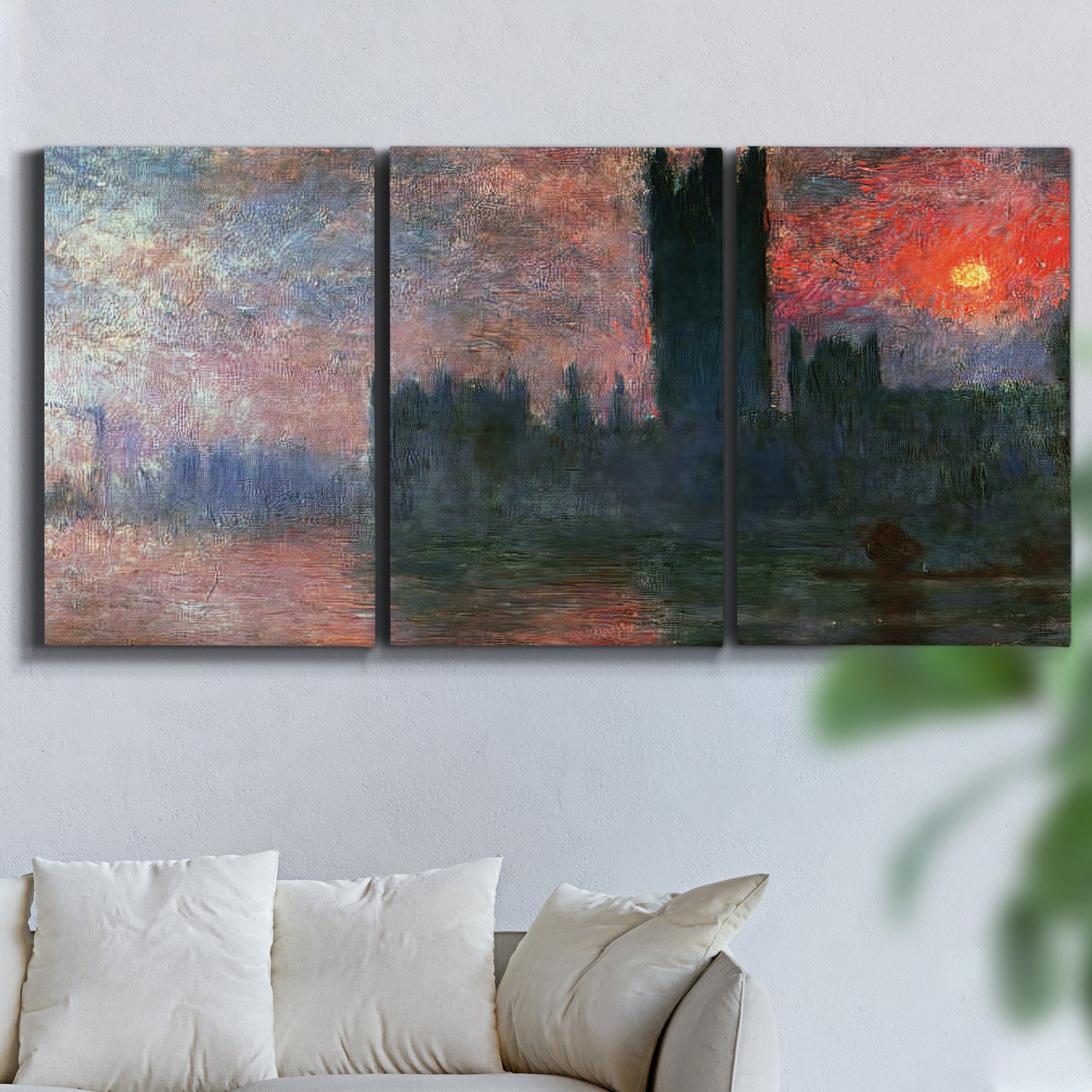 Three-panel canvas wall art featuring parliament silhouetted at dusk, displayed in a living room above a sofa.
