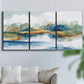 Three-panel canvas wall art featuring abstract blue watercolor landscape, displayed in a living room above a sofa.